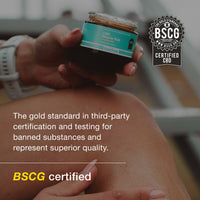 Hand holding a container of CBD product with BSCG certification logo and text.