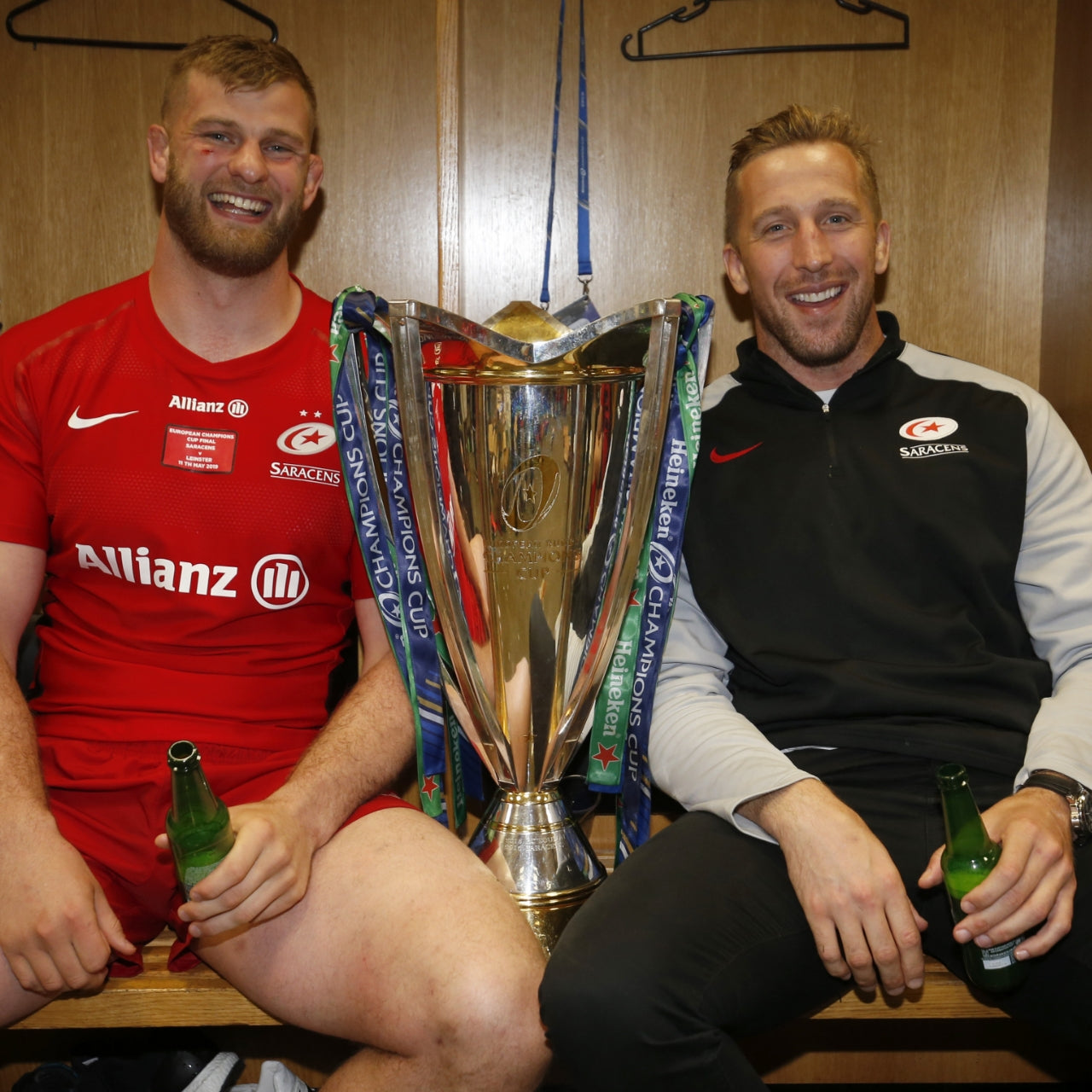 George Kruis and Dom Day sat beside Heineken Champions Cup