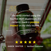 Hand holding a bottle of fourfive Multi Mushroom supplement with a quote and five-star rating from a verified customer.